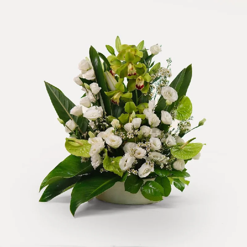 Minimalist wall mirror-special orchids with lily and lisianthus flower arrangement in white ceramic vase