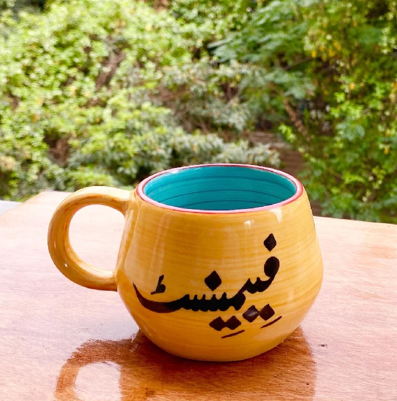 Retro polka dot mug-Feminist Malmo mug in yellow & aqua