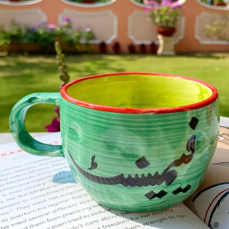 Unbreakable polycarbonate cup-Feminist wobbly mug in sea green. These mugs are hand built so each mug will be different in its crookedness and wobbliness. No two are the same.